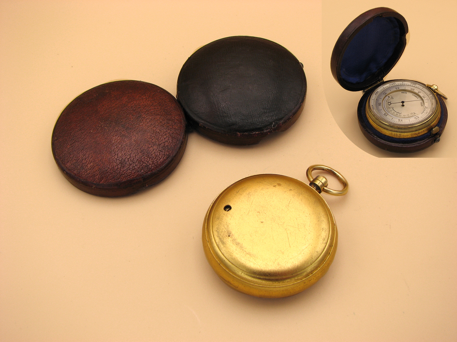 Late 19th century pocket barometer with curved thermometer in outer case